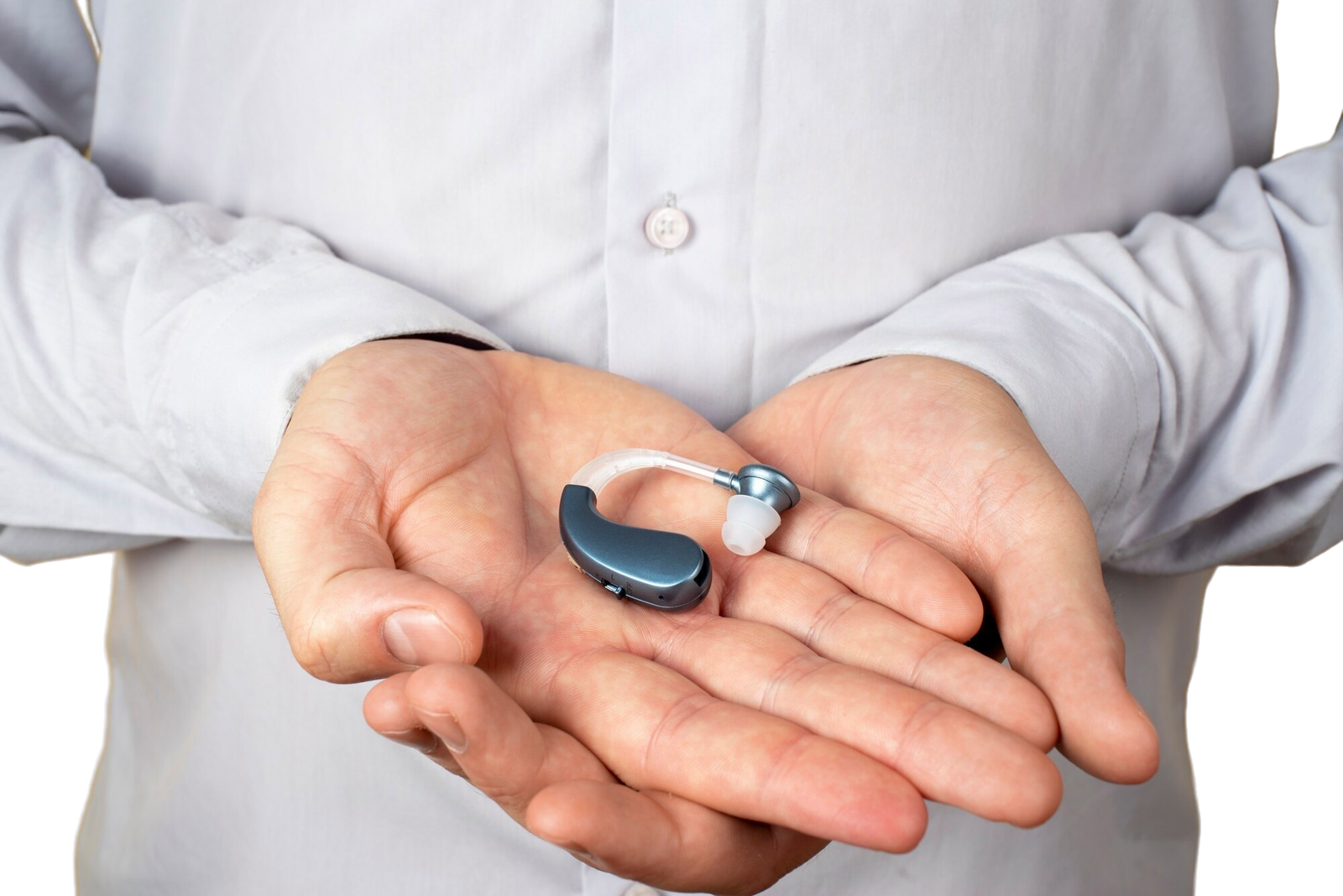 Audiologist fitting a hearing aid for a patient